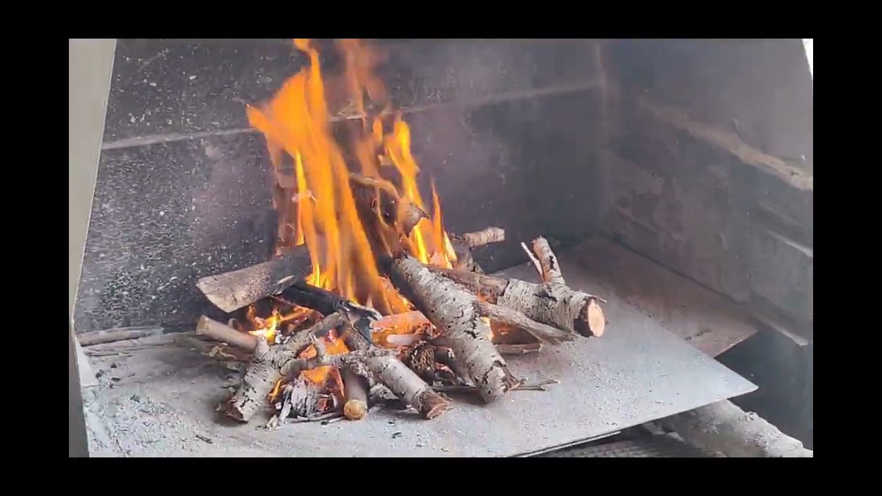 como preparar una barbacoa de leña