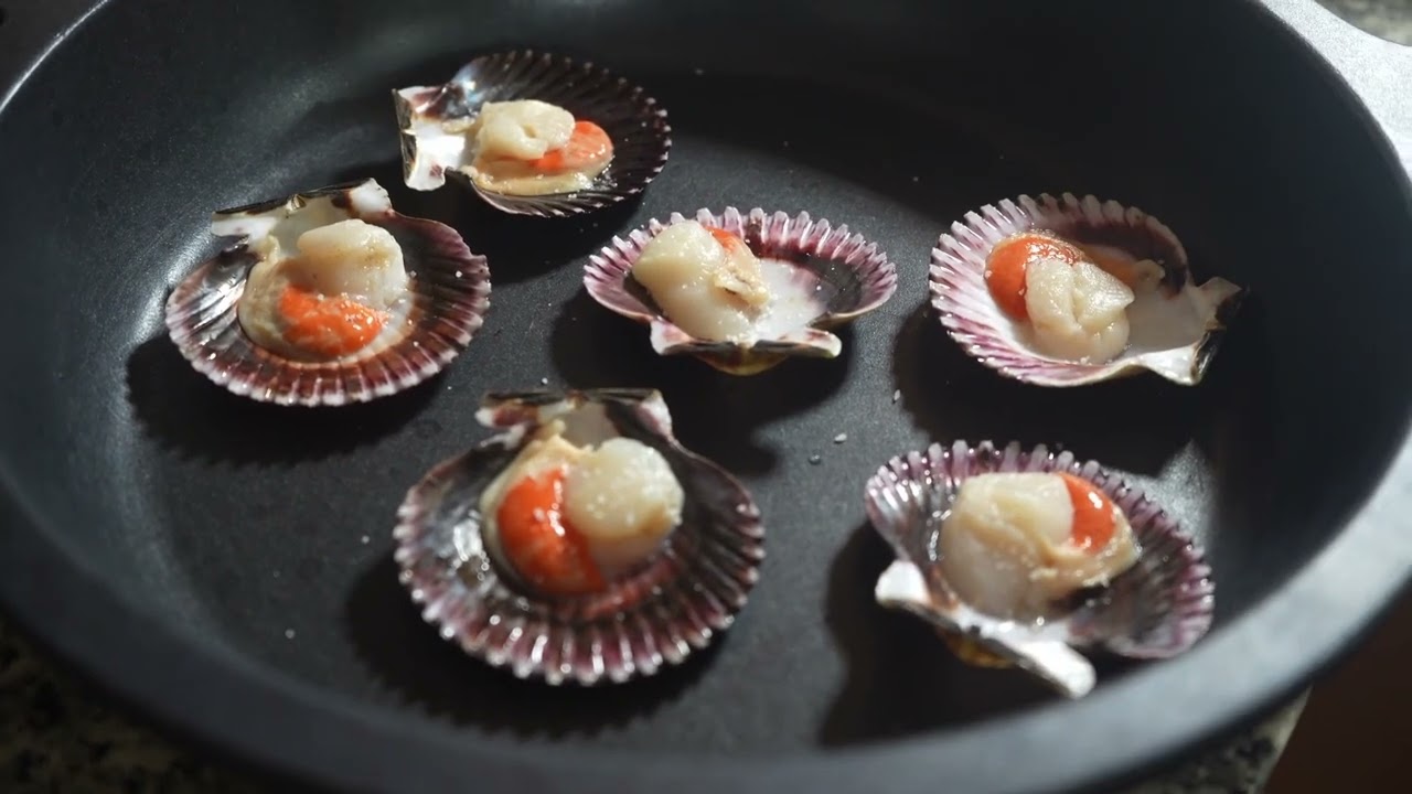 Zamburiñas al horno en salsa de vino blanco